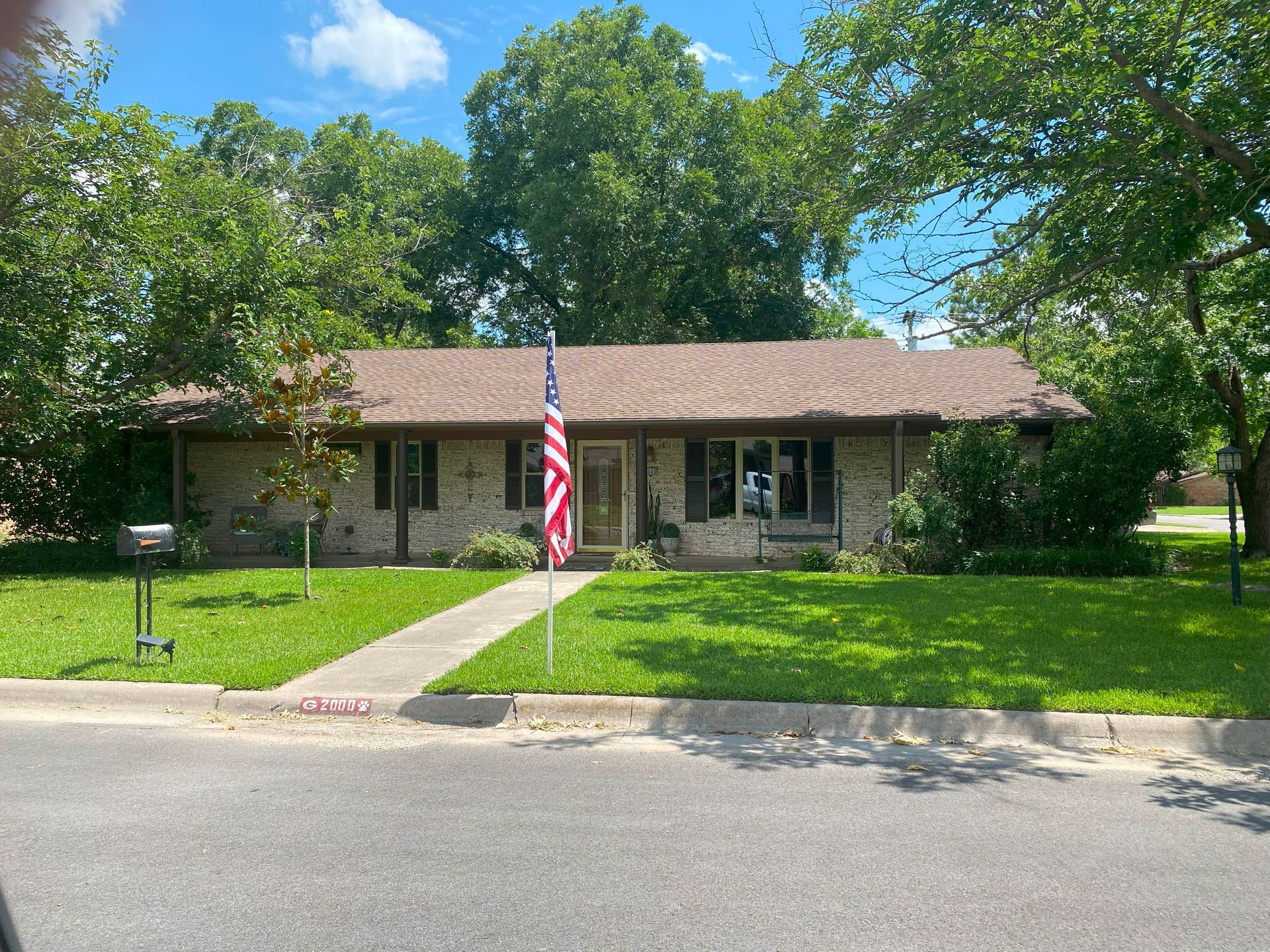 A house with an american flag in front of it