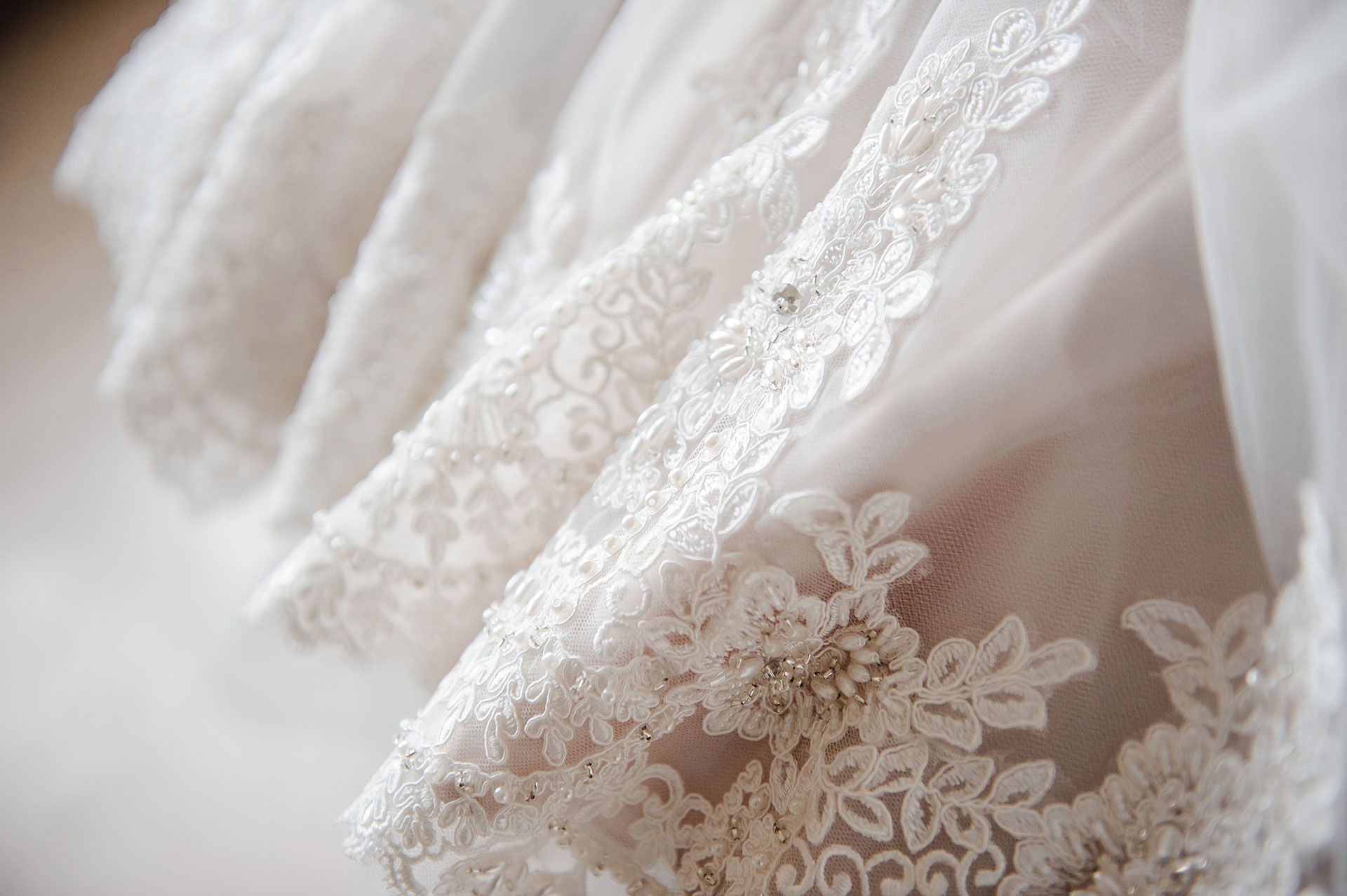 Embroidery on the dress made by wedding dress designer