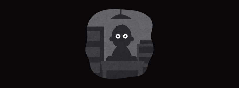 A cartoon of a person with big eyes sitting at a table in a dark room.