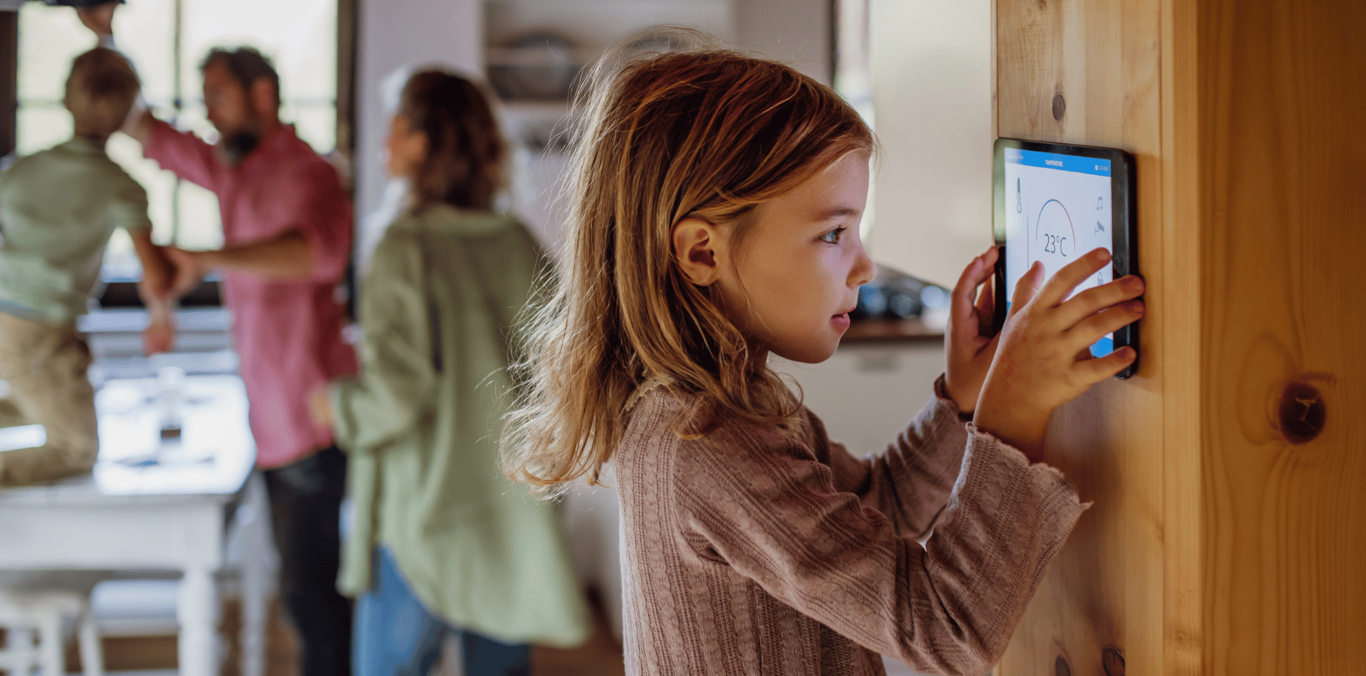 A child using a smart thermostat