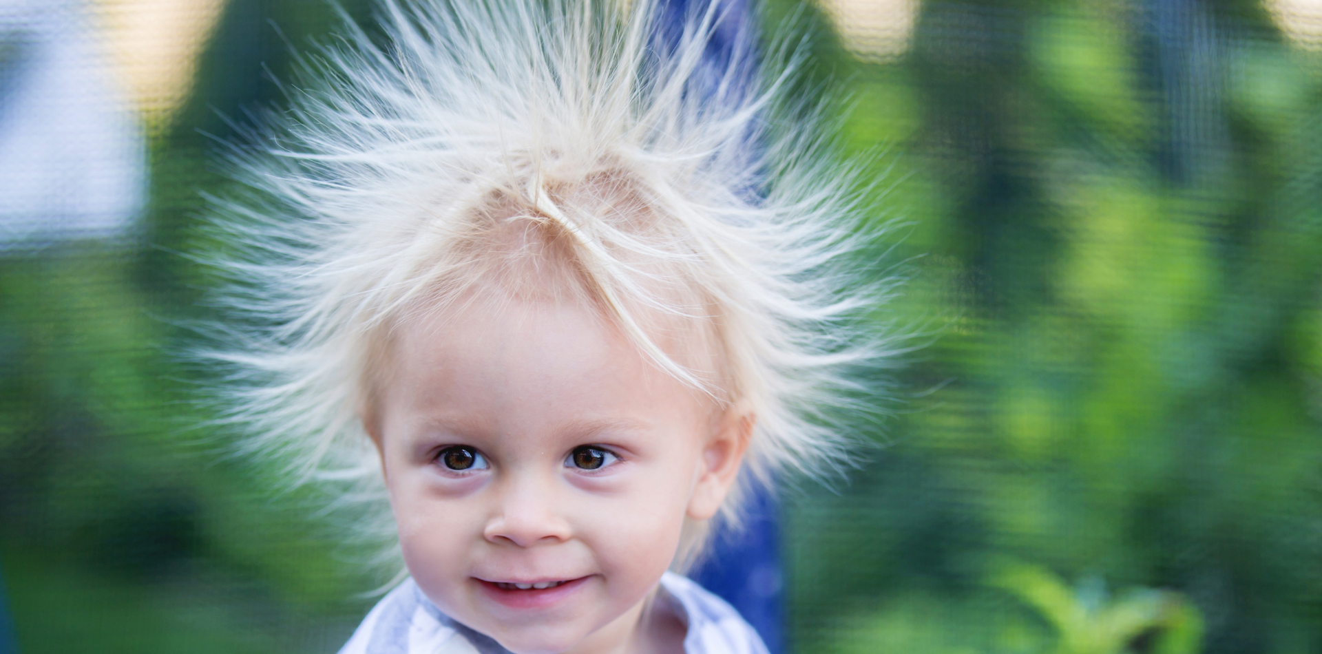 Young girl with hair standing up from static electricity