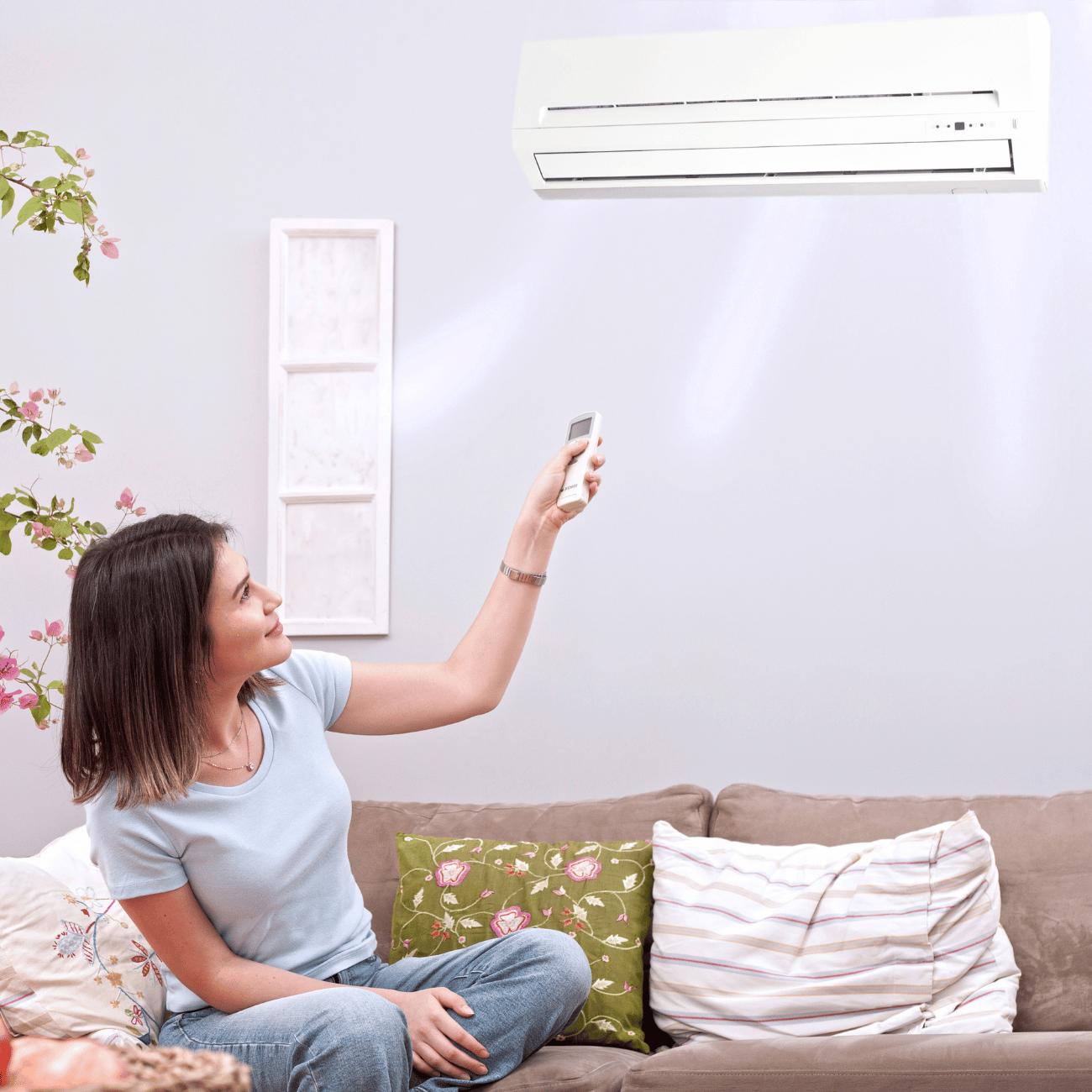 Woman using an air conditioner