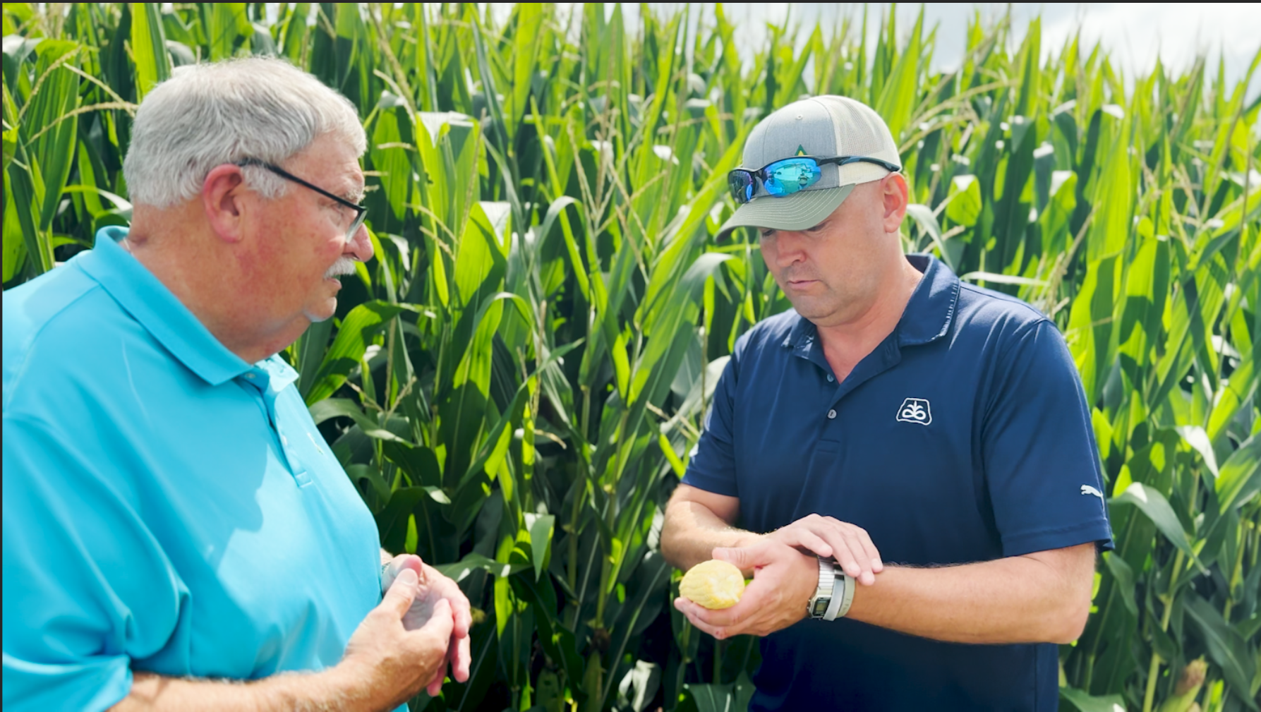 Roger and Luke outside of cornfield