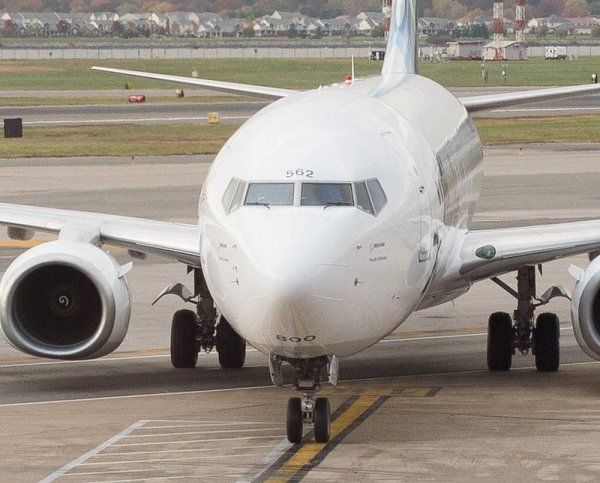 A white airplane with the number 242 on the front