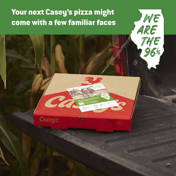 A casey 's pizza box sits on the back of a truck
