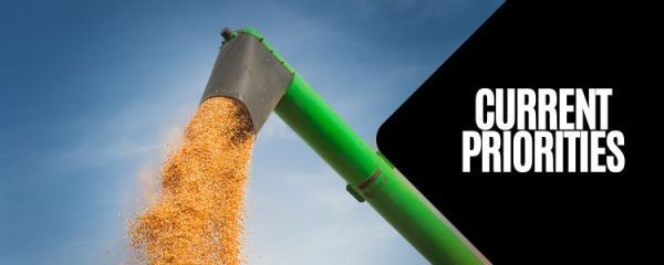 A sign that says current priorities on it