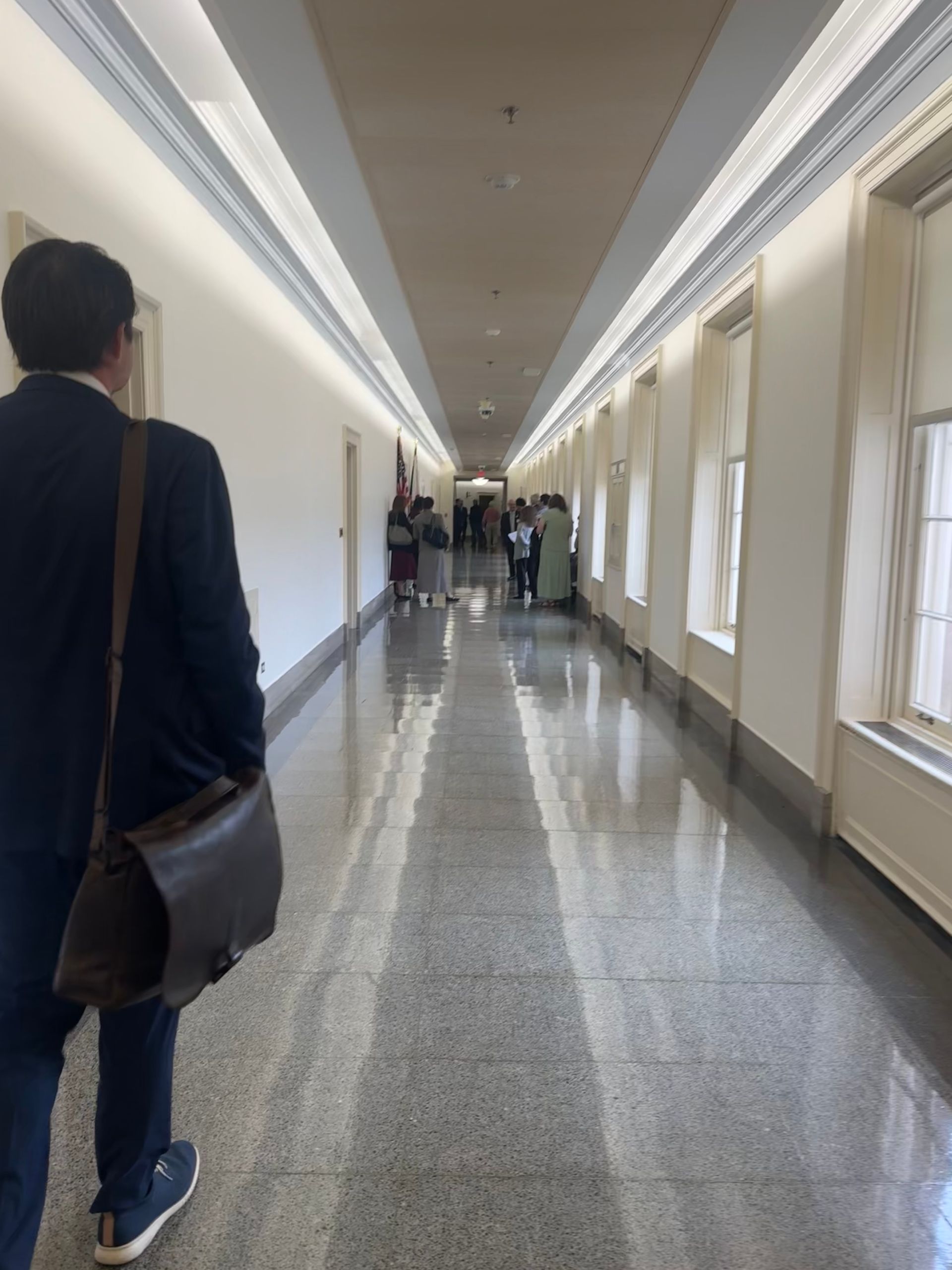 Jon Hurst walking in Longworth House Office Building