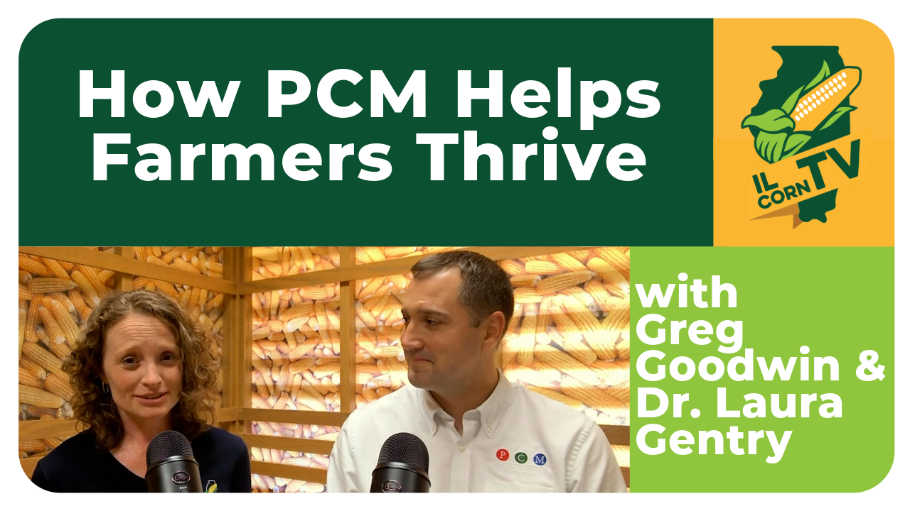 A man and woman are standing next to each other in front of a sign that says how pcm helps farmers thrive.