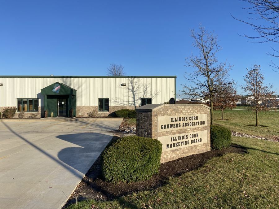 A large building with a sign in front of it.