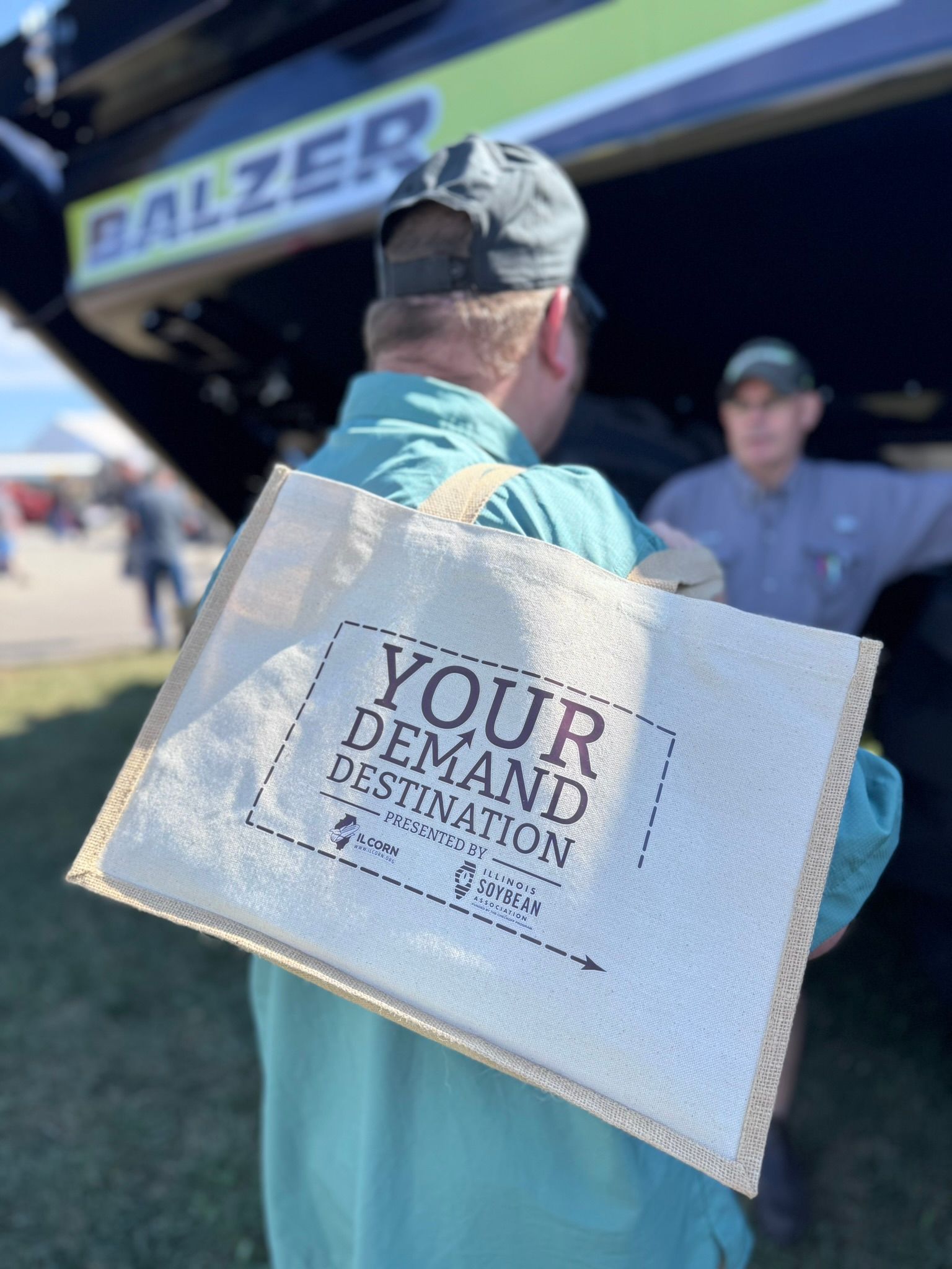 Man holding a beige bag with 