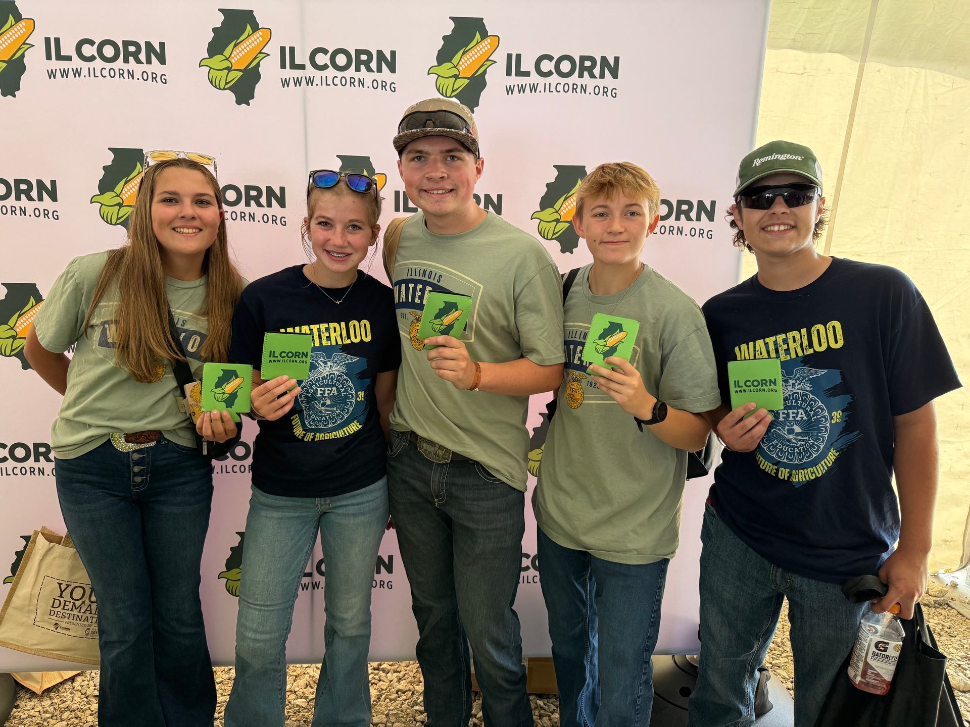 Five people pose with 