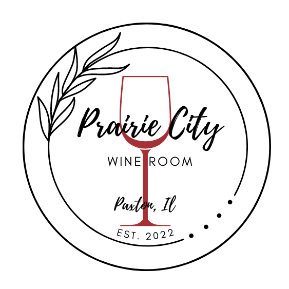 Logo for Prairie City Wine Room in Paxton, IL, featuring a wine glass, leaves, and text within a circle.