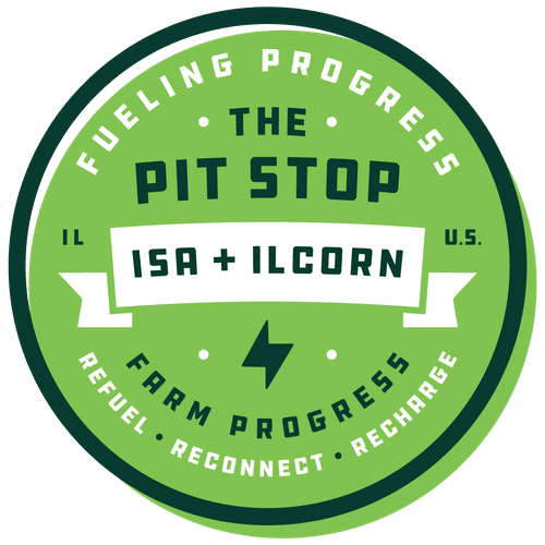 A green circle that says fueling progress the pit stop isa + ilcorn