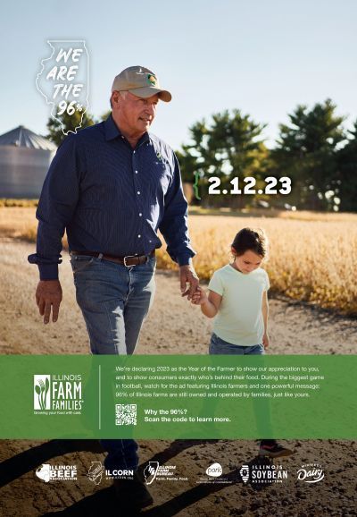 A man and a little girl are holding hands in a field.