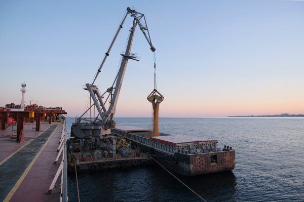 A large crane on a boat in the ocean