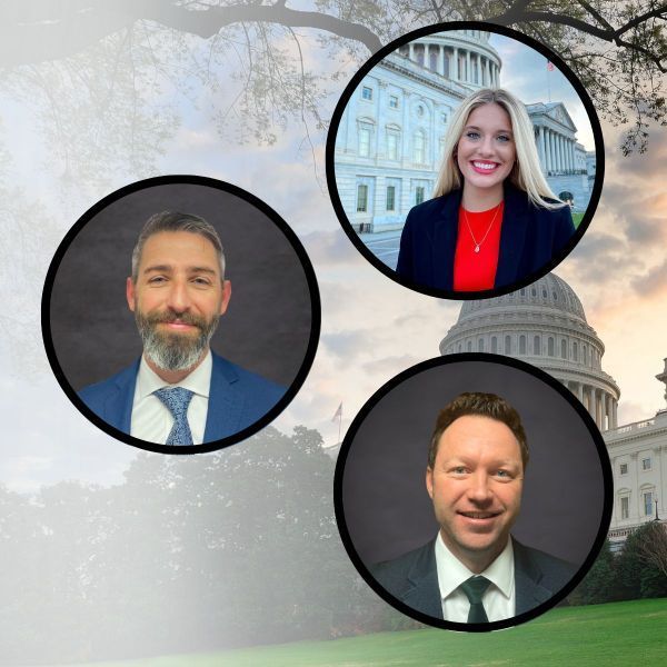 Three people are standing in front of the capitol building