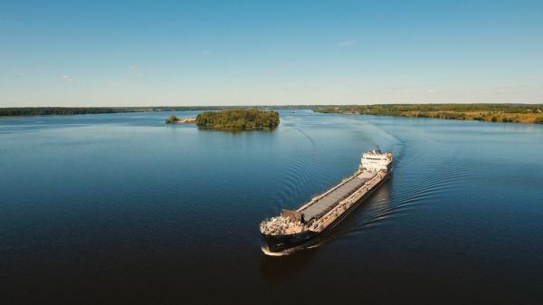 An aerial view of a large ship floating on top of a large body of water.