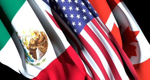 A row of flags including an american flag and a mexican flag