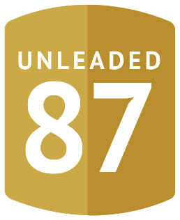 A gold shield with the number 87 on it