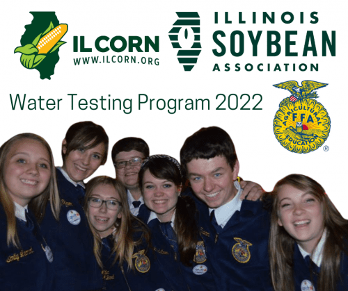 A group of people are posing for a picture in front of an illinois soybean association logo