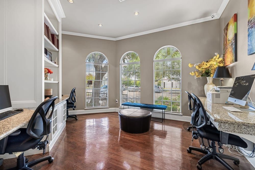 a room with two desks and two chairs in it at Marquis on Westheimer in Houston, TX.