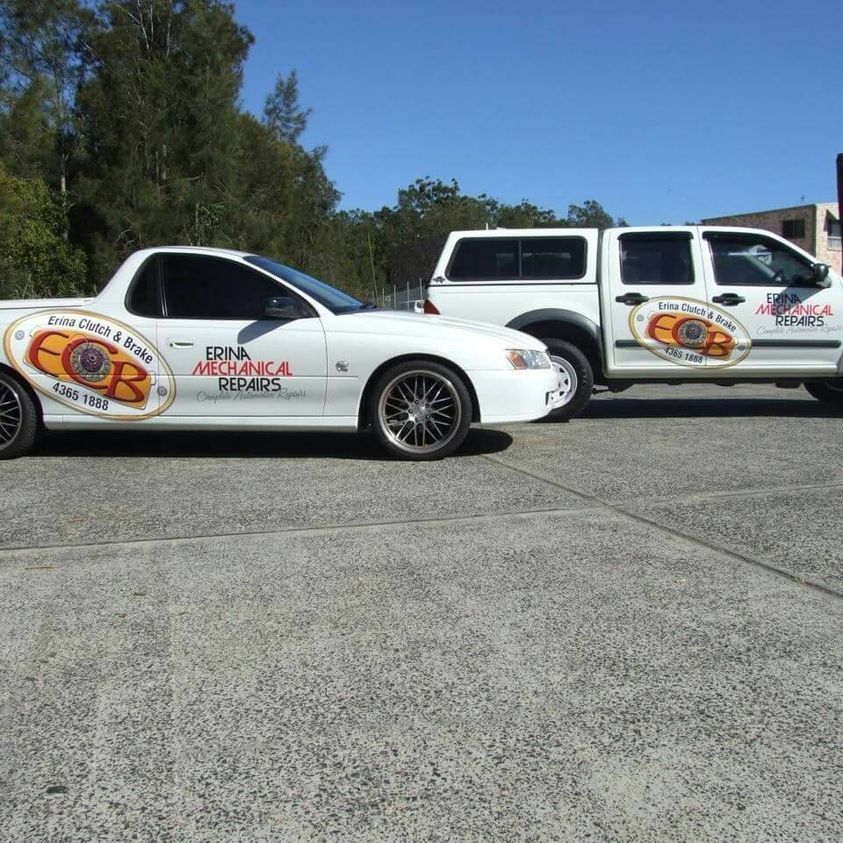 Two White Vehicles with Company Logo: A Ute and A Car — Erina Mechanical Repairs In Erina, NSW