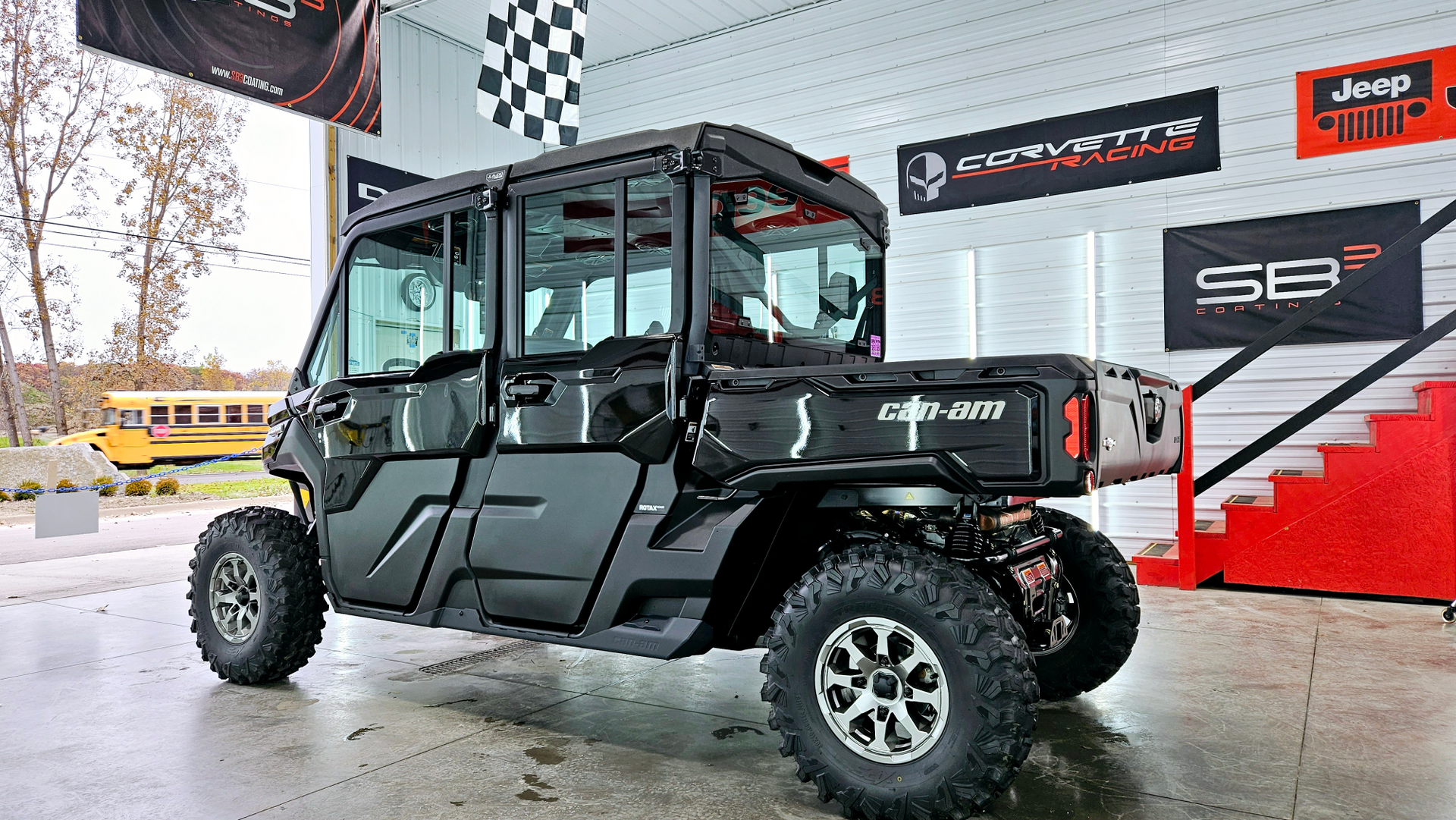 A black utility vehicle is parked in front of a building.