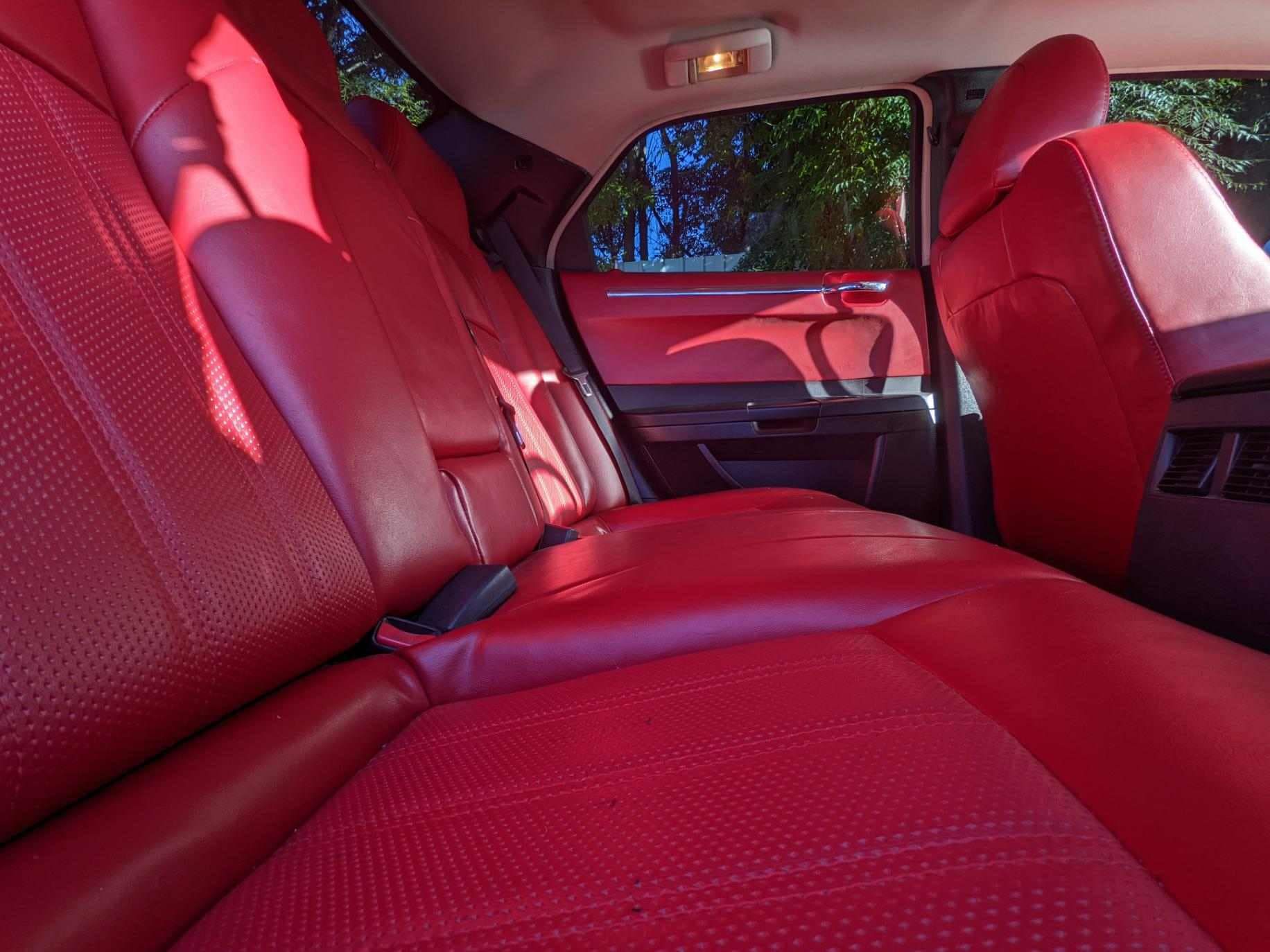 The Back Seat Of A Car With Red Leather Seats — JM Upholstery In Dubbo, NSW