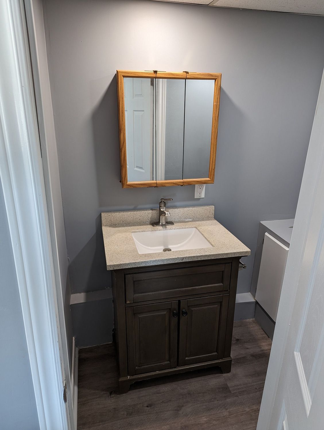 Small Mirror and Faucet in Bathroom — Oshawa, ON — Fire Beard Contracting