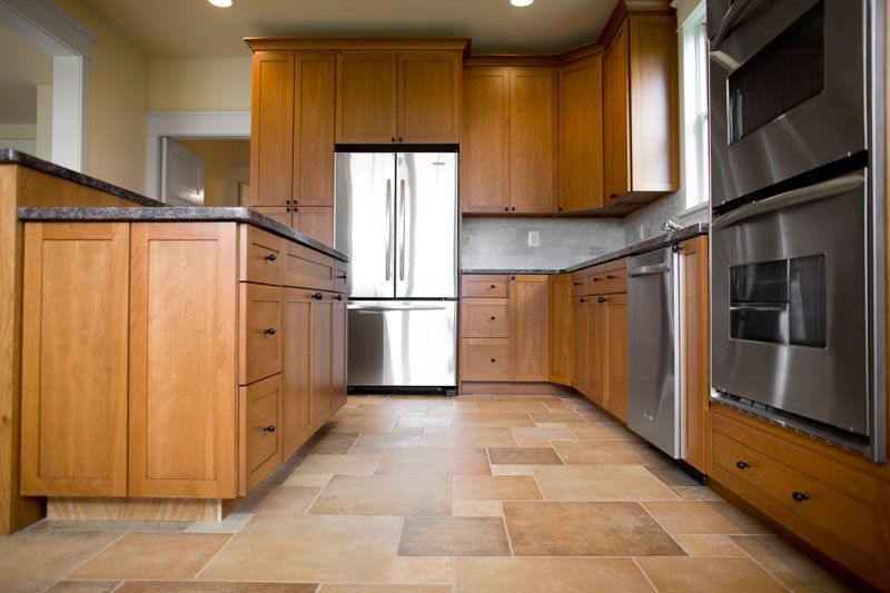 Kitchen Remodeling — Newly Installed Kitchen Wooden Cabinets  in Longview, TX