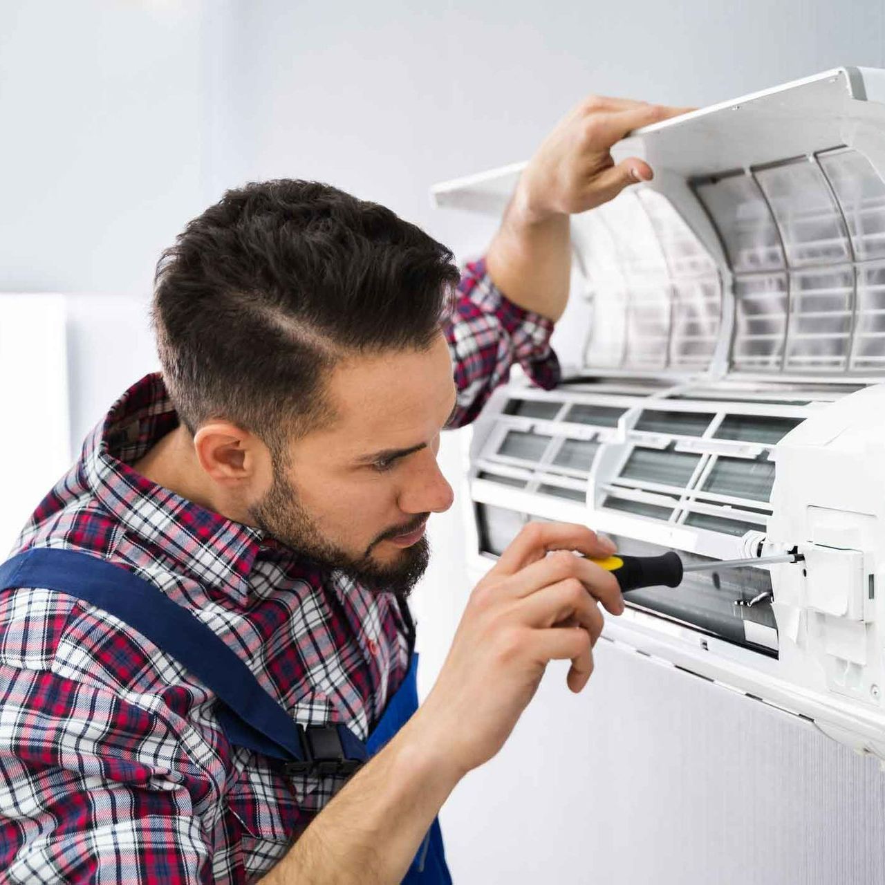 Technician Repairing Air Conditioner — Stockton, NJ — Custom Cooling Services LLC