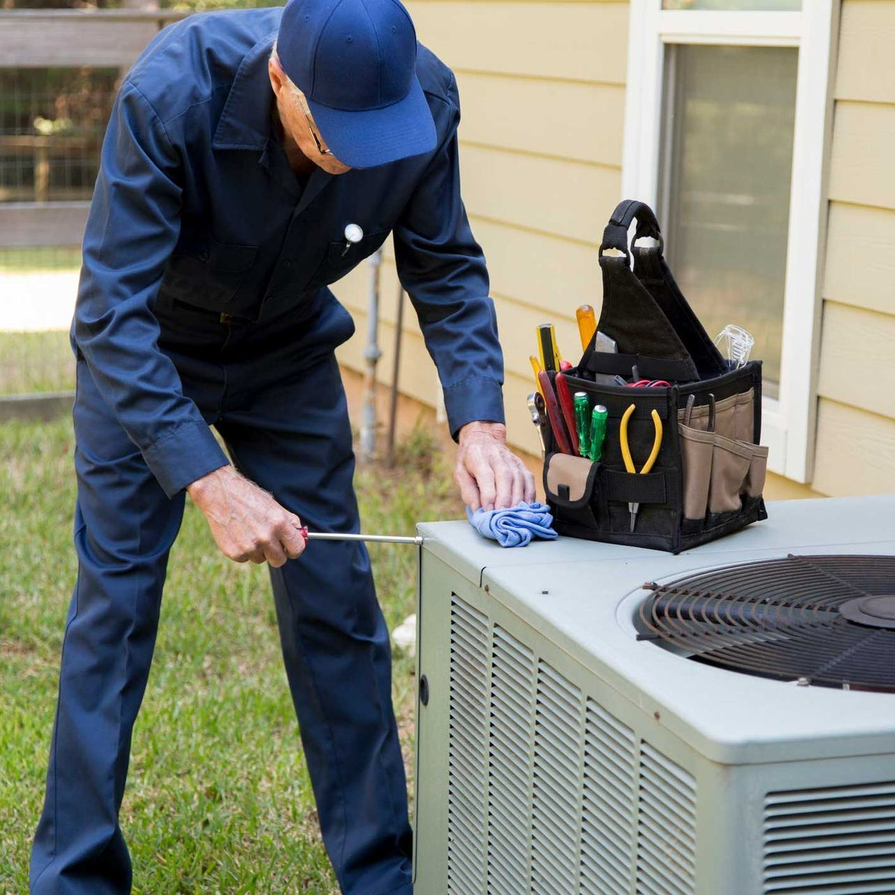 HVAC Technician Working on Outdoor Unit — Stockton, NJ — Custom Cooling Services LLC
