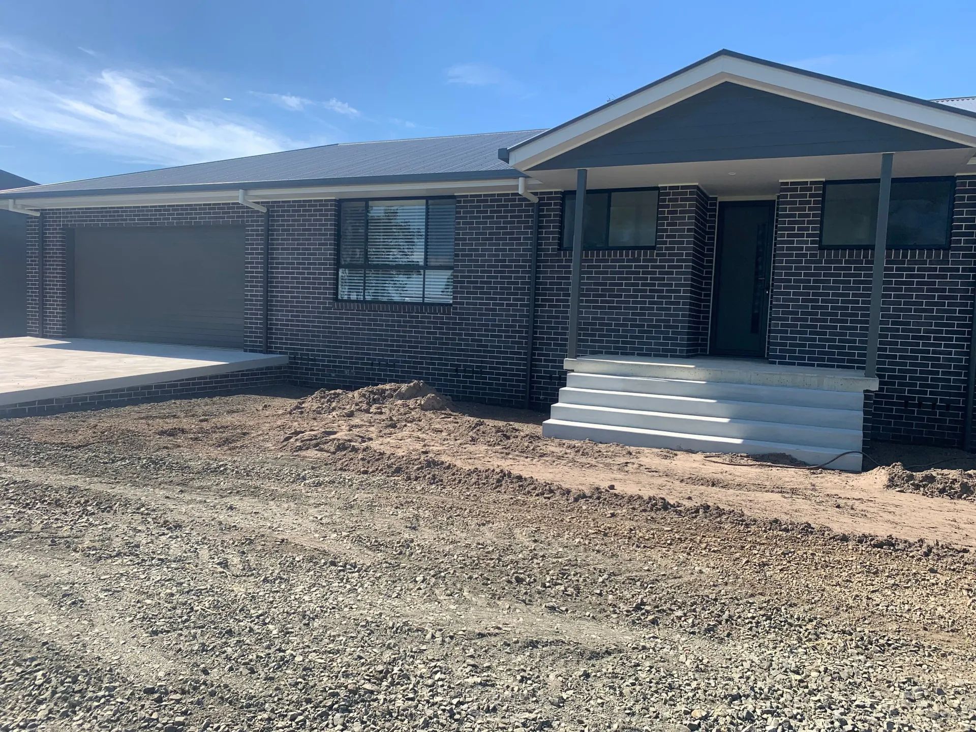 Brick House with A Small Porch and Driveway — C & S Building Pty Ltd In Alstonville, NSW