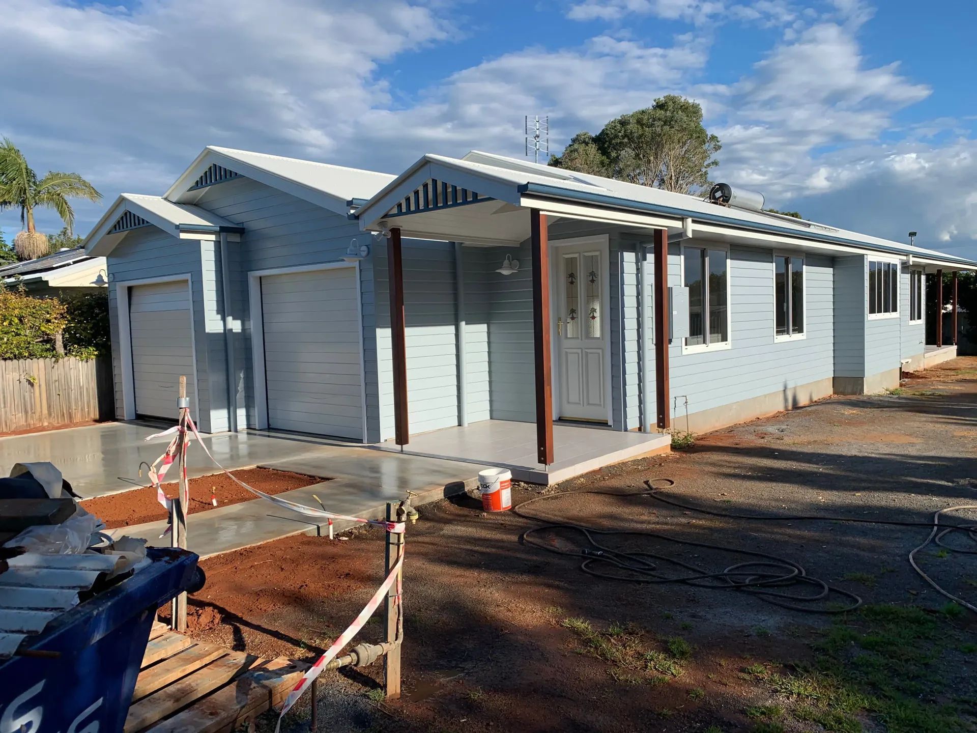 Light Blue House with White Trim, Two Garage Doors — C & S Building Pty Ltd In Bentley, NSW