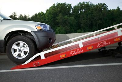 SUV being loaded on tow truck - Towing and Roadside Assistance in Sarasota, FL