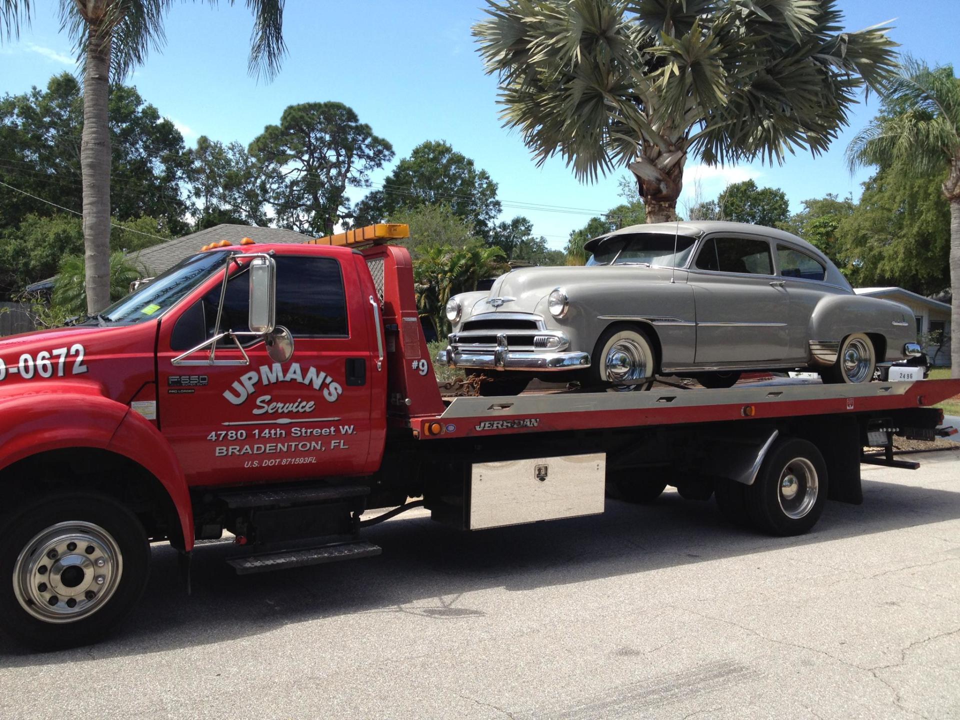 Towing a silver car - Roadside assistance in Sarasota, FL