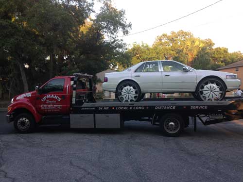 Towing a white car - Roadside assistance in Sarasota, FL