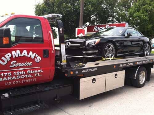 Towing a black car - Roadside assistance in Sarasota, FL