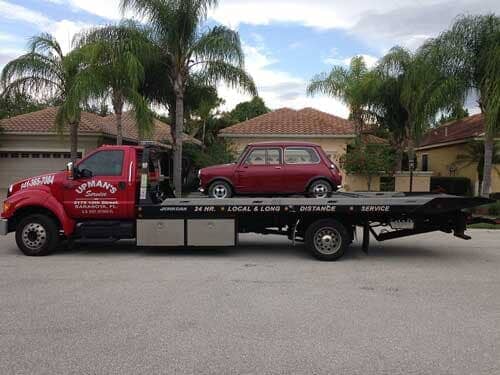 Towing a red car - Roadside assistance in Sarasota, FL