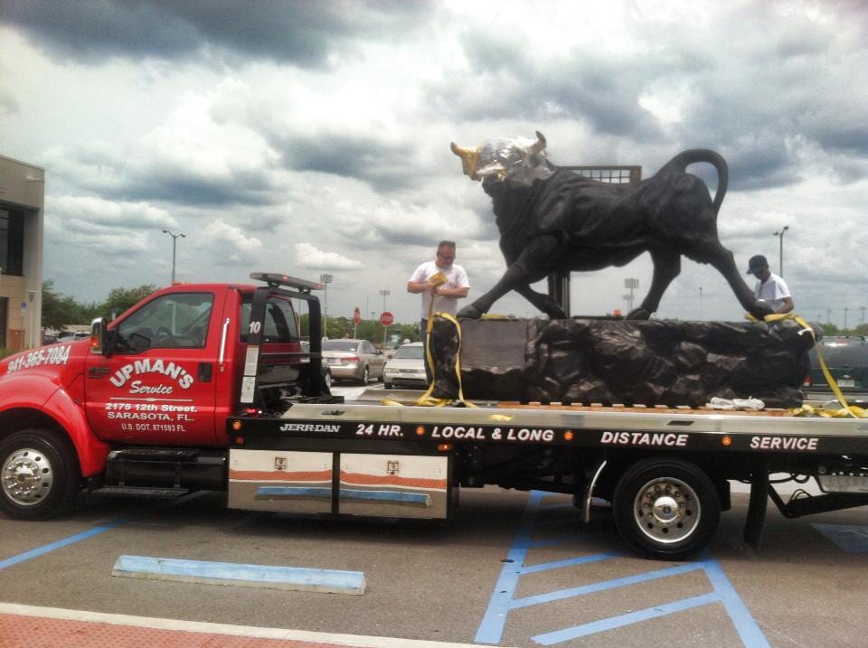 Upman Towing a bull statue - Roadside assistance in Sarasota, FL
