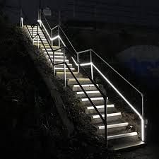 A set of stairs that are lit up at night, project completed by Aarons lighting & Design. 