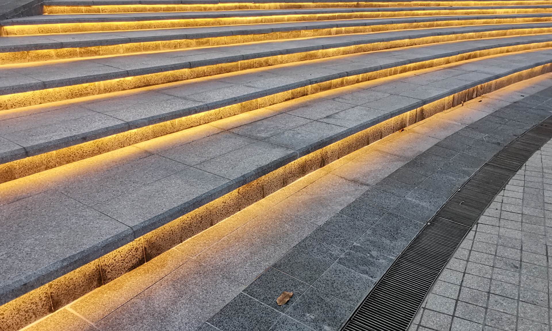A close up of a set of stairs with lights on them.