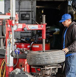 A man wearing a blue shirt that says new life