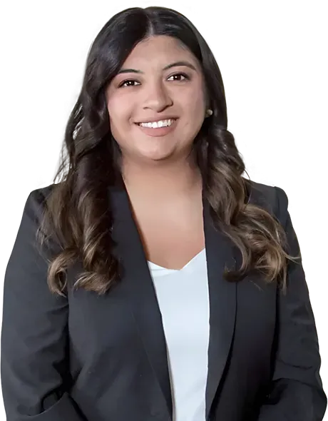 A woman in a black jacket and white shirt is smiling for the camera.