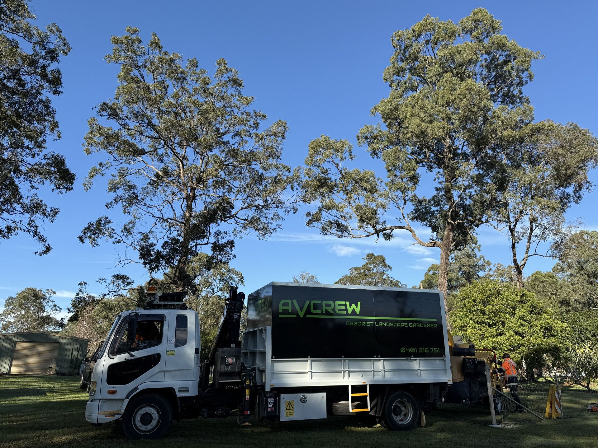 work truck infront of tree's and a blue sky — Alex's Vegetation in Port Macquarie, NSW