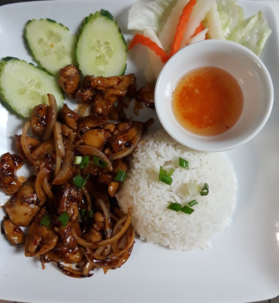 A plate of food with rice and vegetables on it