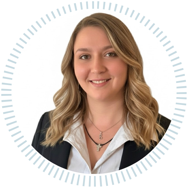 A woman in a plaid jacket and black shirt smiles in a circle