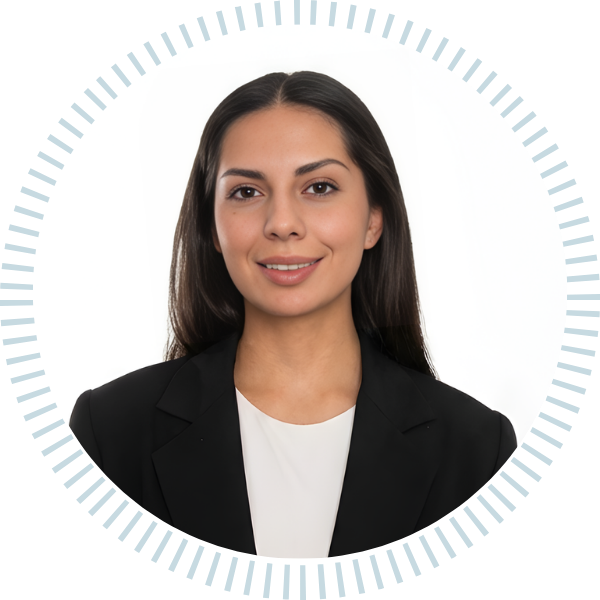 A woman in a plaid jacket and black shirt smiles in a circle