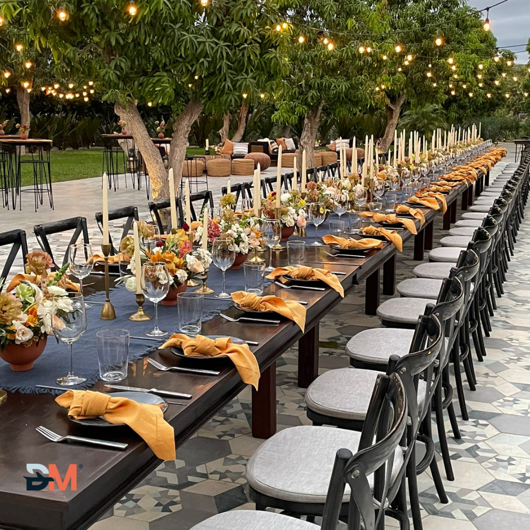 A long table with a lot of flowers on it