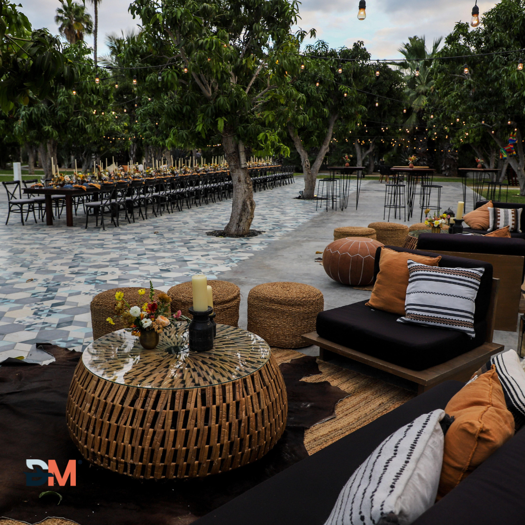 A patio area with a wicker table and chairs